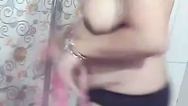 Beautiful MILF stripping in bathroom before nude bath